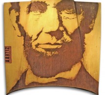 ’75 Lincoln Continental hood serves as canvas for rusty portrait of Abraham Lincoln