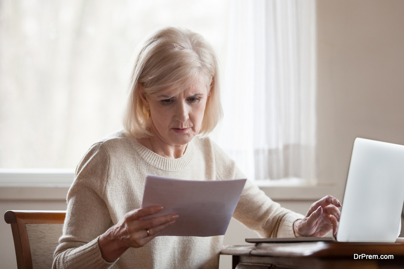 old woman checking insurance claim