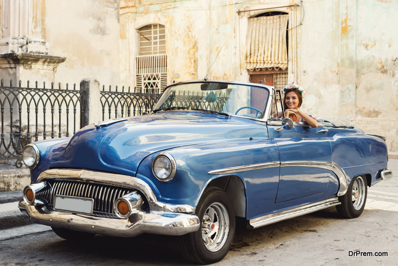 woman sitting in the classic car