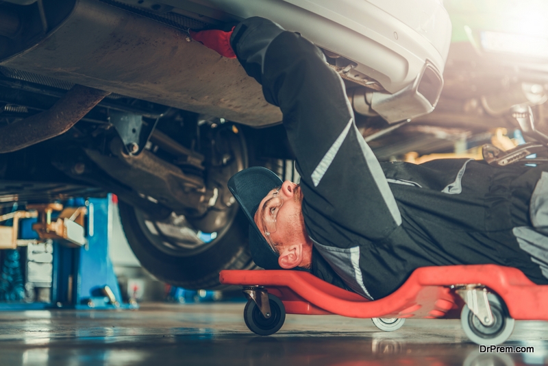 Mechanics Creeper Trying To Fix Modern Vehicle 