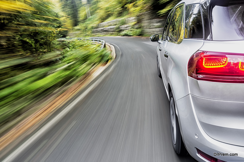 Motion blur shot a generic car driving fast on the road