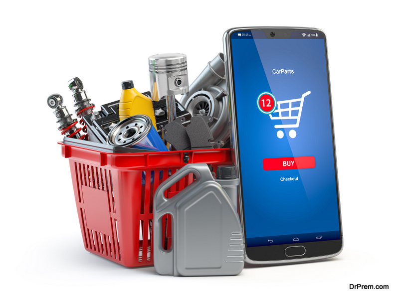 Car parts, spares and accesoires in shopping basket and smartphone