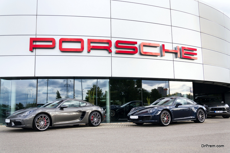 Cars in front of Porsche automotive company 