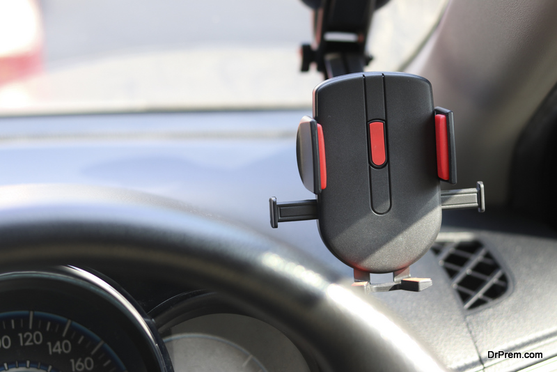 Mobile phone holder on the car for safety while driving a vehicle